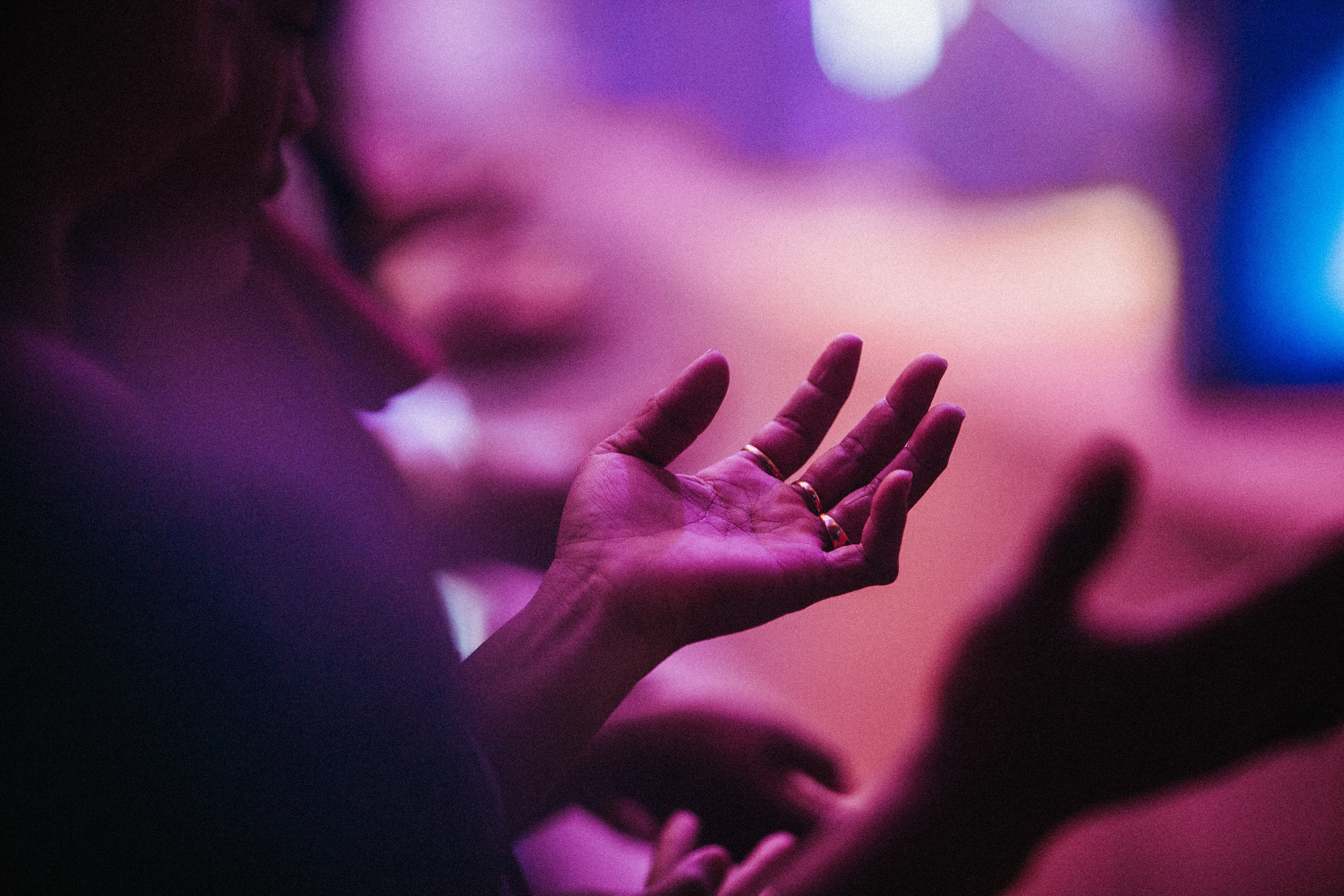 Person raising hands in prayer